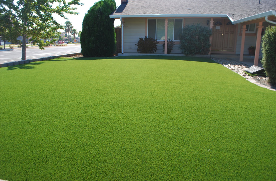 In the backyard of the home, artificial turf is installed 
